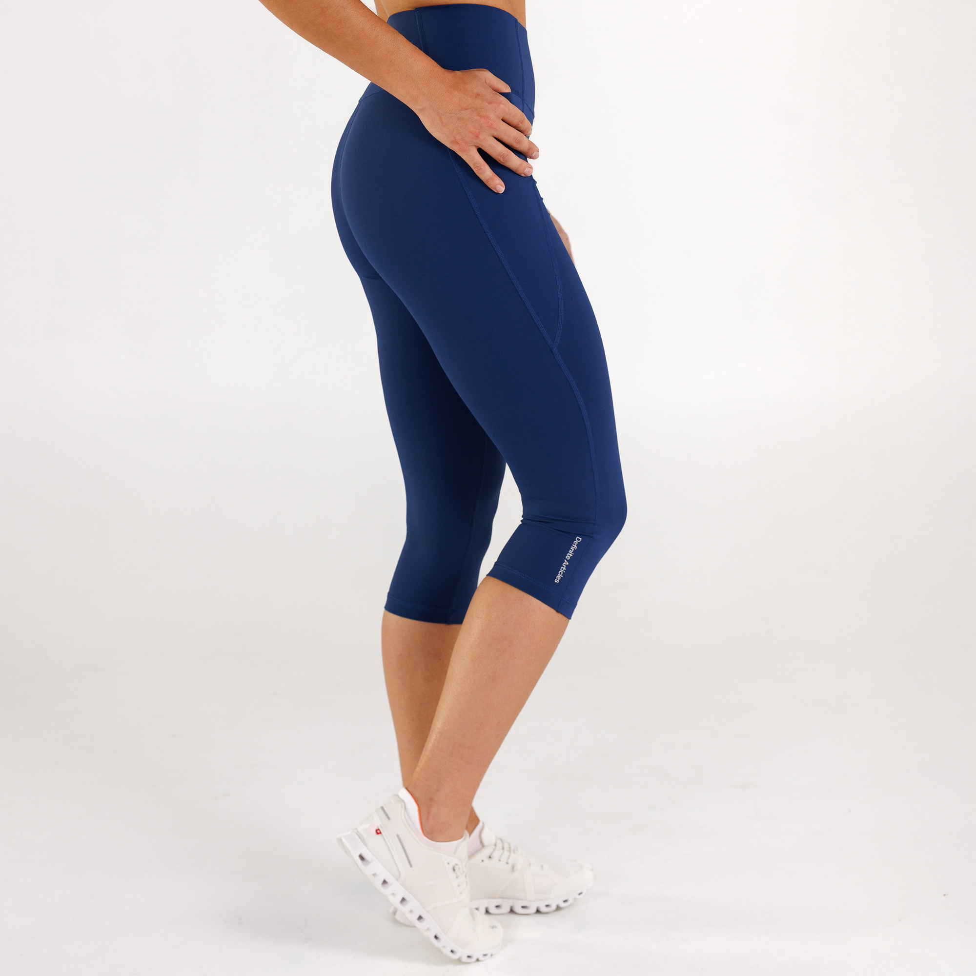 Woman wearing estate blue Trimline Capri Leggings by Definite Articles.