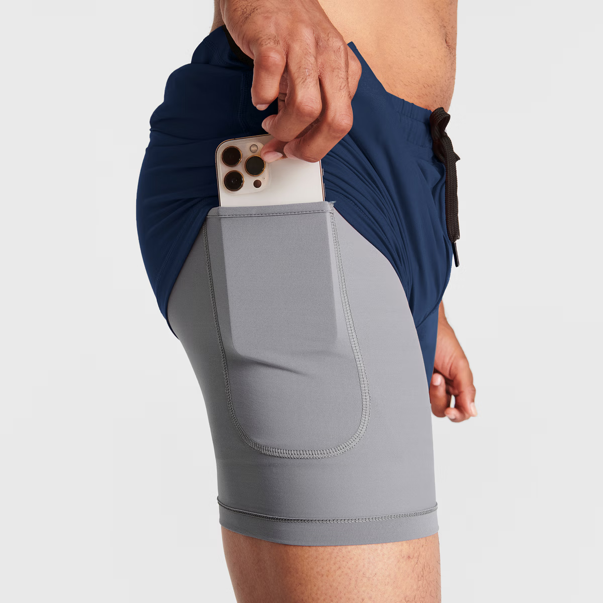 Man wearing navy blue Tor Shorts by Definite Articles. Closeup on pockets.