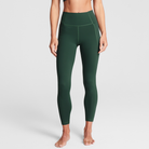 Woman wearing olive Trimline 7/8 Leggings by Definite Articles, front.