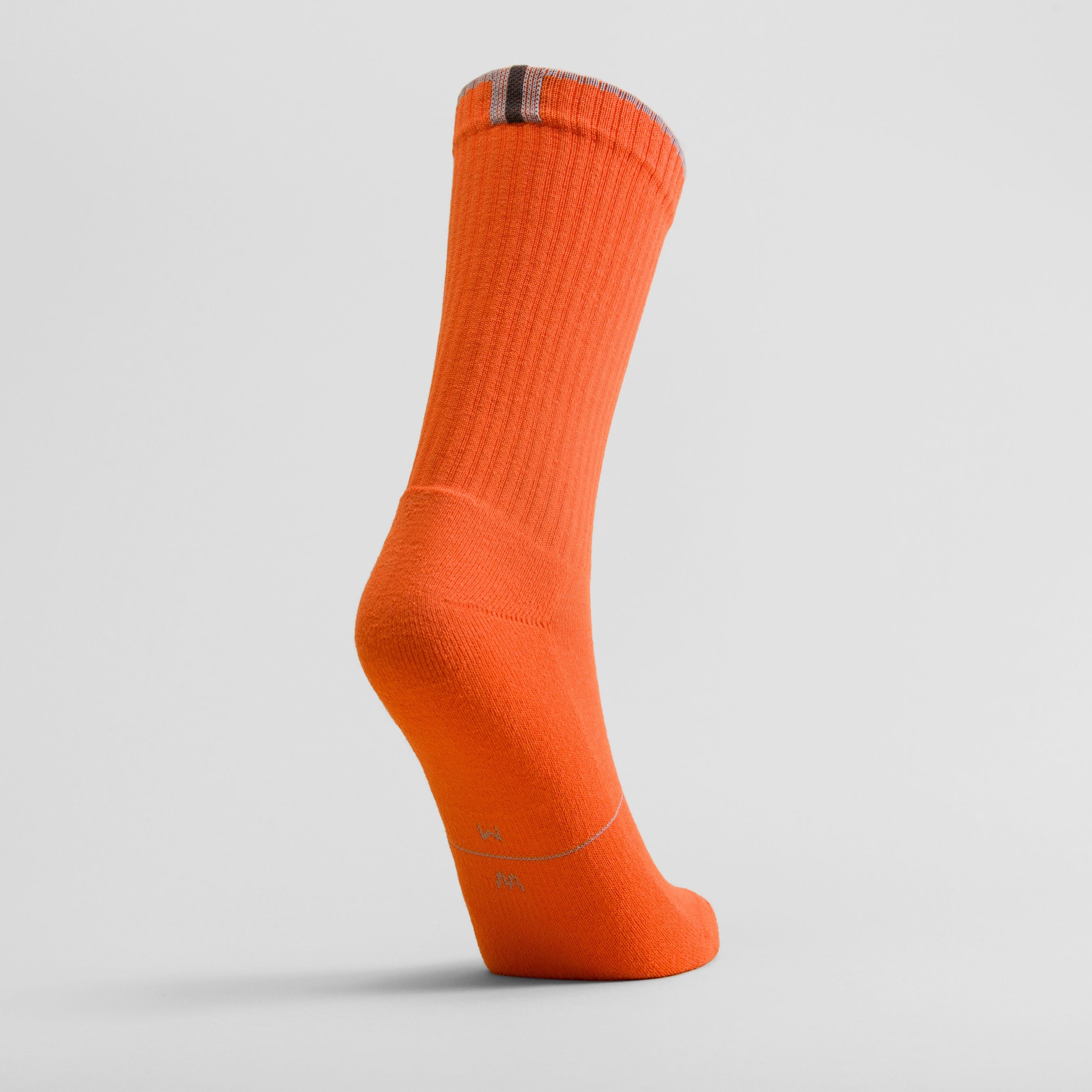 Orange women's crew sock by Definite Articles, lifestyle shot on white background