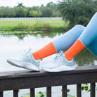 Orange women's crew sock by Definite Articles, on foot