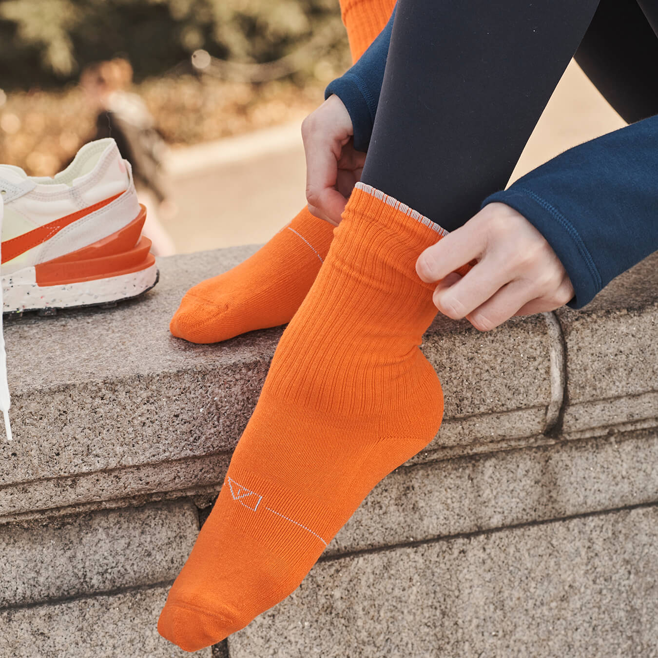 Orange women's crew sock by Definite Articles, close-up of cuff