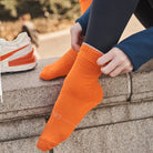 Orange women's crew sock by Definite Articles, close-up of cuff