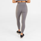 Woman wearing abalone shell Trimline 7/8 Leggings by Definite Articles. Viewed from behind.