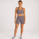 Woman wearing abalone shell Trimline 5" Shorts by Definite Articles. 