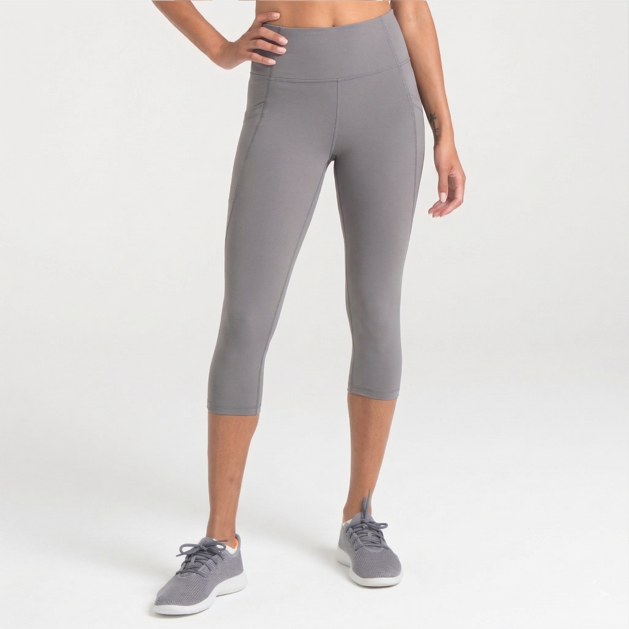 Woman wearing abalone shell Trimline Capri Leggings by Definite Articles.