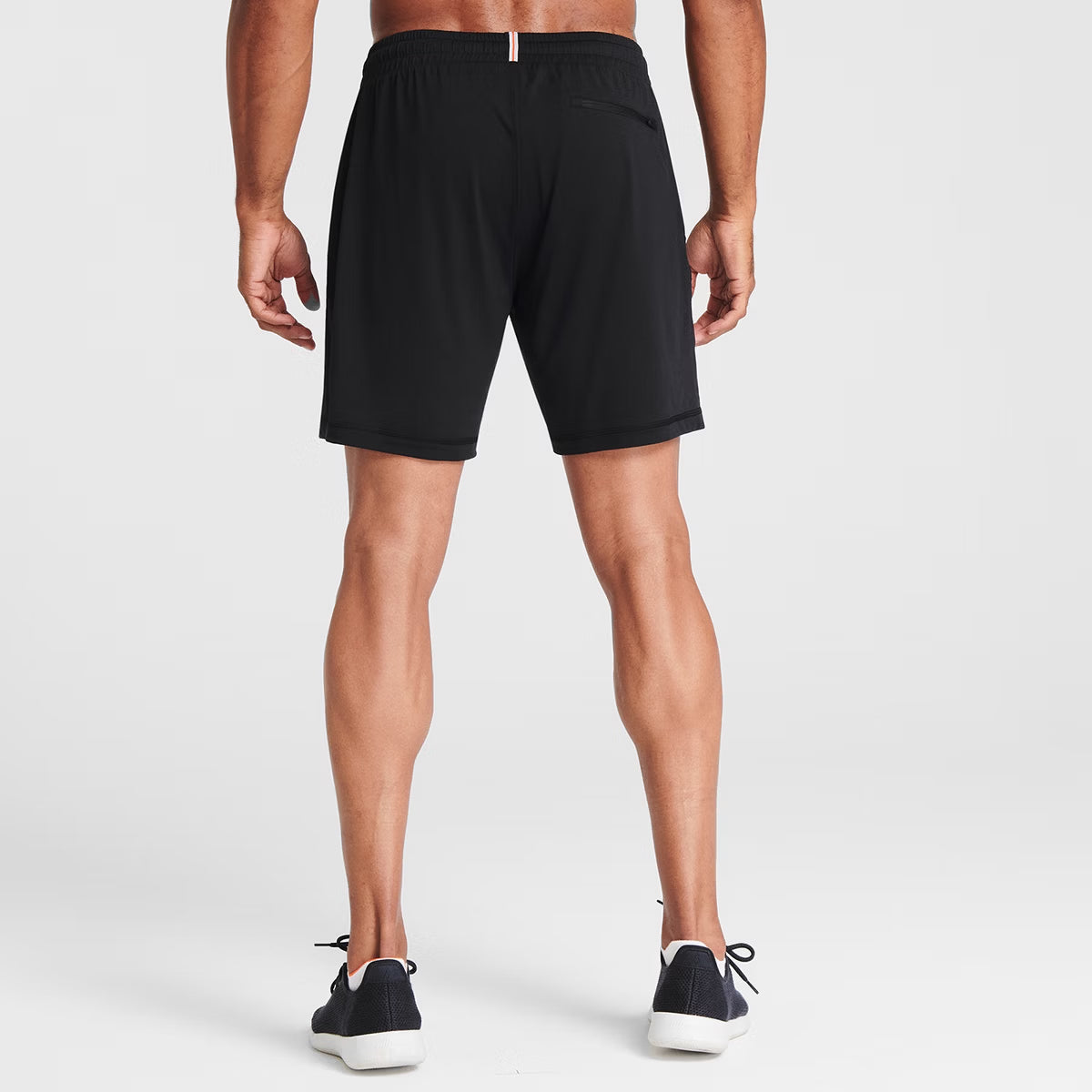 Man wearing black Tor Shorts by Definite Articles. 