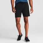 Man wearing black Tor Shorts  by Definite Articles. 
