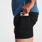 Man wearing black Tor Shorts  by Definite Articles. Closeup on pocket.