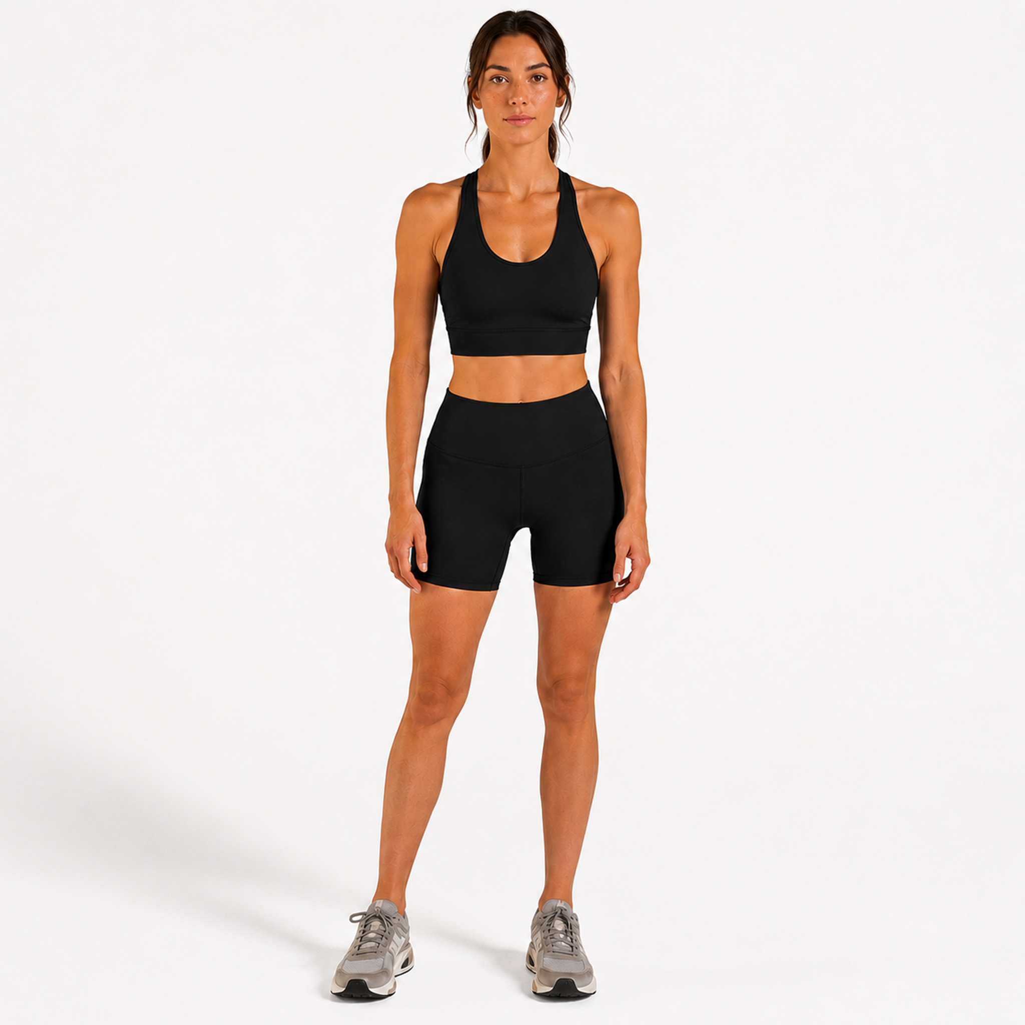 Woman wearing black Trimline 5" Shorts by Definite Articles. White background.