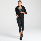 Woman wearing black Trimline Capri Leggings by Definite Articles.