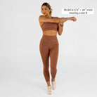 Woman wearing carob brown Trimline Natural-Waist 7/8 Leggings by Definite Articles. Model is 5'9" + 26" waist wearing a size S.
