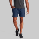 Man wearing estate blue Tor Shorts  by Definite Articles. 