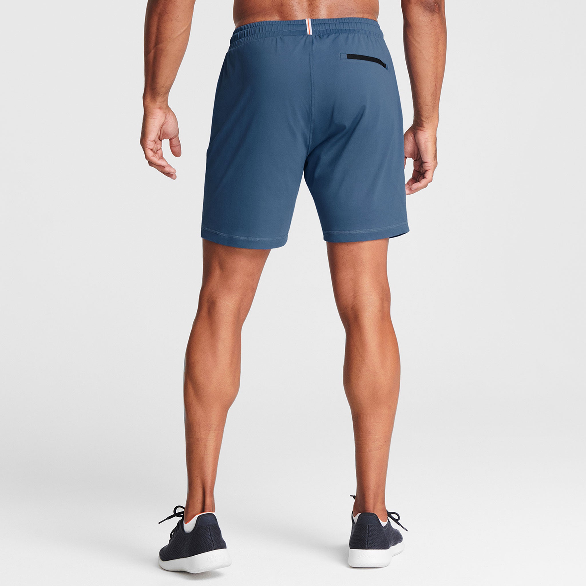Man wearing ocean blue Tor Shorts  by Definite Articles. 
