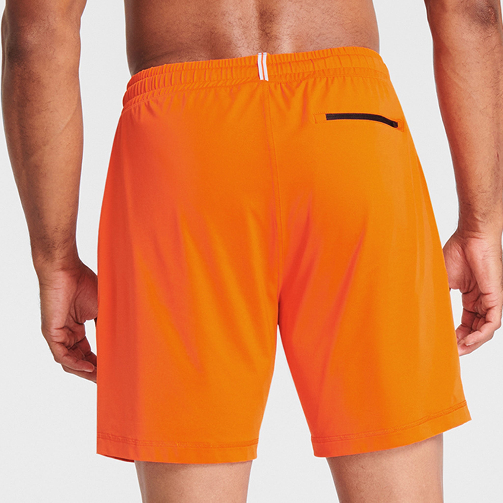 Man wearing orange Tor Shorts  by Definite Articles.