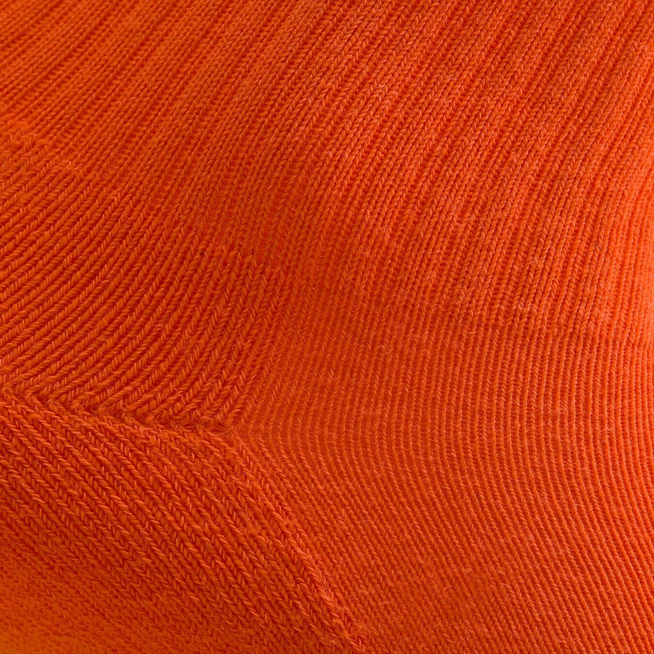 Orange women's crew sock by Definite Articles, close-up of fabric texture