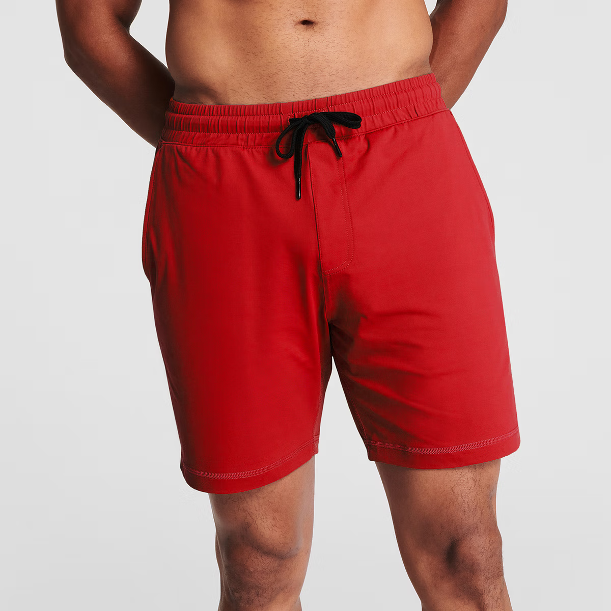 Man wearing scarlet red Tor Shorts  by Definite Articles. 