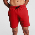 Man wearing scarlet red Tor Shorts  by Definite Articles. 