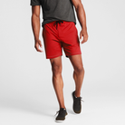 Man wearing scarlet red Tor Shorts by Definite Articles.
