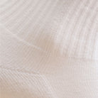 White women's crew sock by Definite Articles, close-up of fabric texture