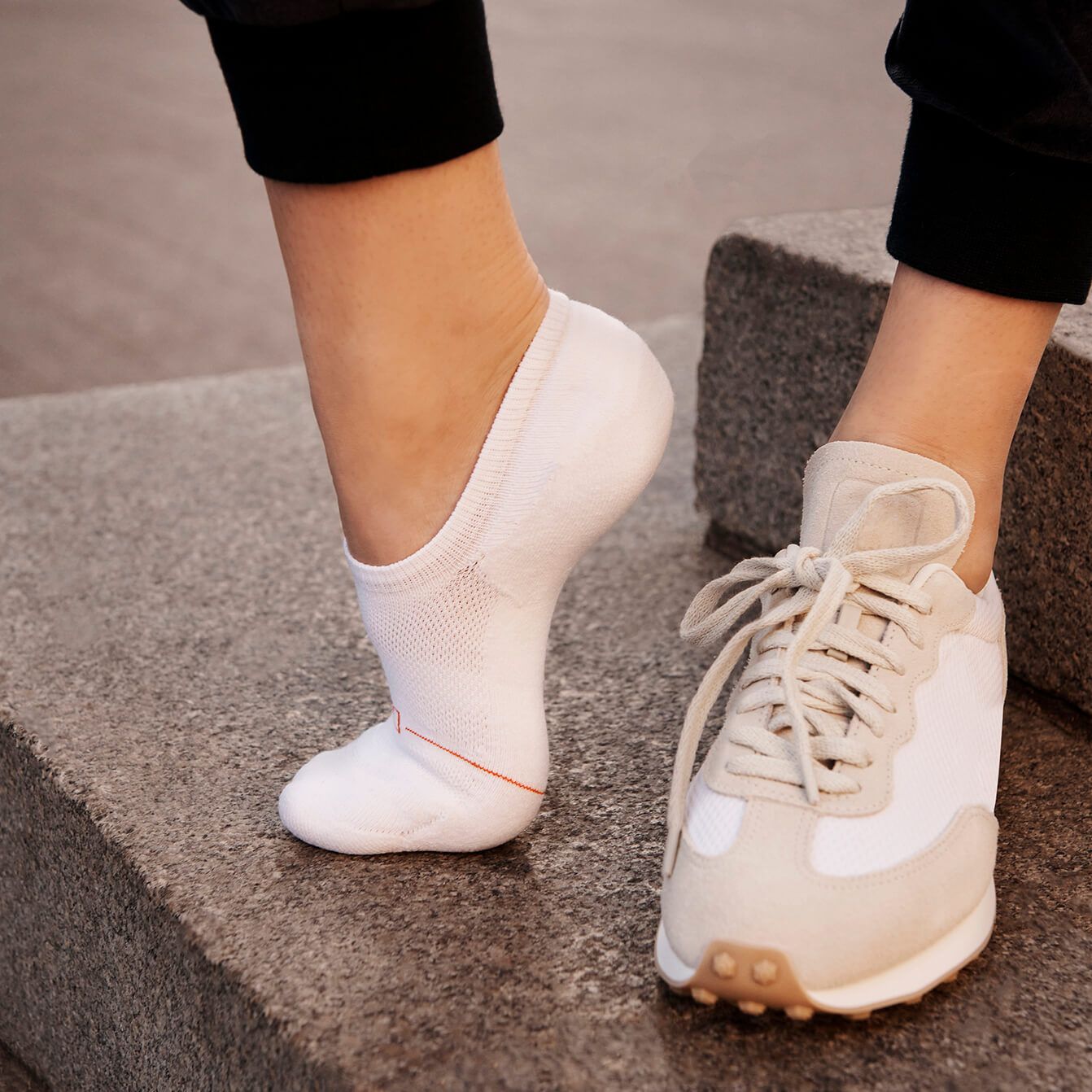 Woman wearing white no-show sock by Definite Articles, on foot
